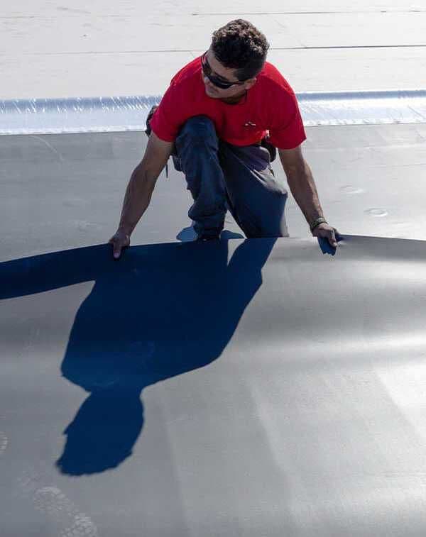 Modex crew installing new TPO membrane on a Twin Cities commercial building