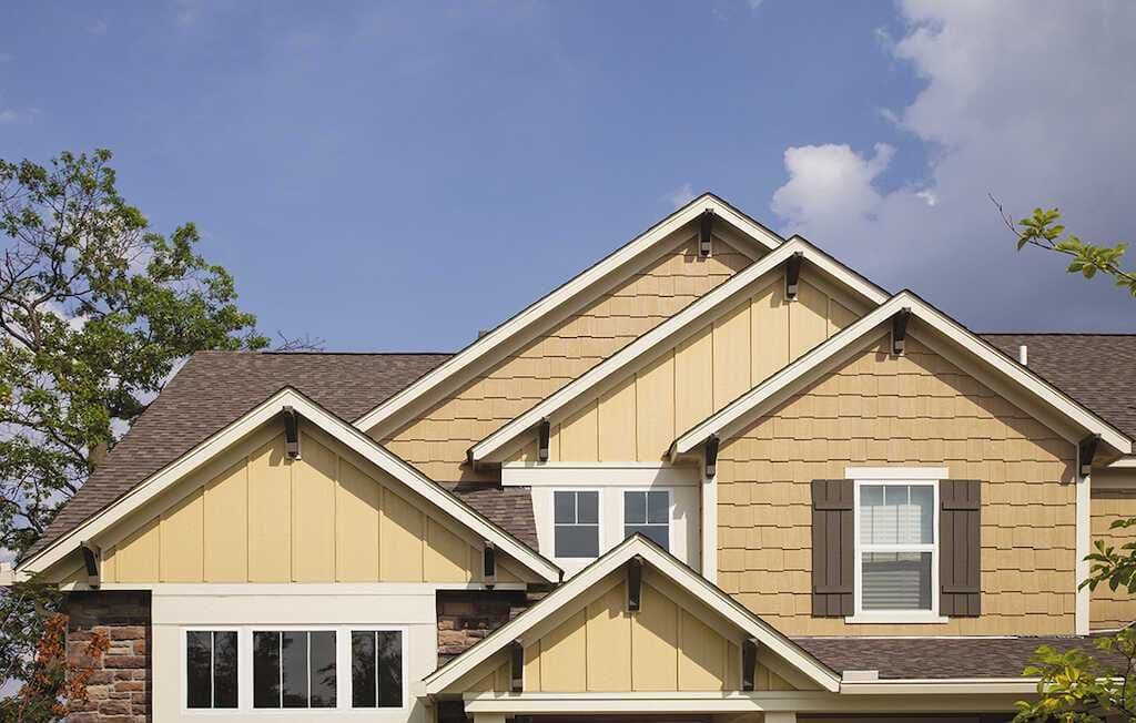 Twin Cities home with new siding and gable roof installed by Modex