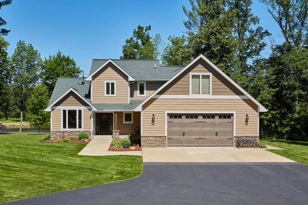 Diamond Kote French Gray siding with white trim installed by Modern Exterior Systems