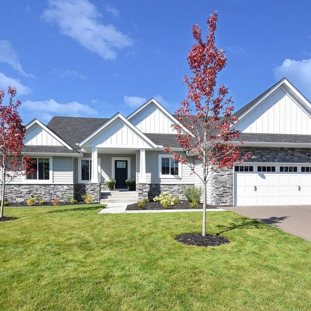 EDCO Entex Series Driftwood Gray with Glacier White trim on a residential home