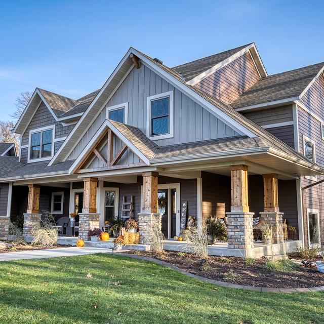 EDCO Entex Series steel siding in Driftwood Gray + Timber trim on a Twin Cities home